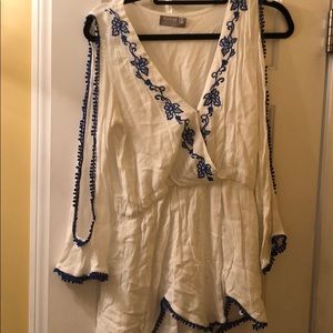 White romper with blue flower detailing from LF